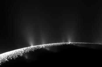 Image of the south pole of Enceladus, showing dust emission (water ice grains) from cracks in the ice crust.